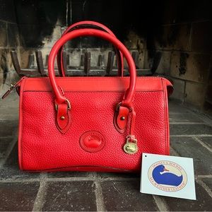 Vintage Dooney Bourke zip-top satchel in red with matching red trim original tag